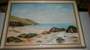 An oil on canvas beach scene signed M Parr,