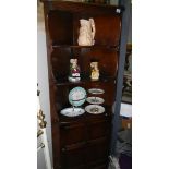 An oak corner cabinet.