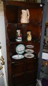 An oak corner cabinet.