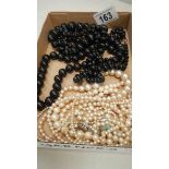 3 black bead necklaces, 2 pearl necklaces and one other a/f necklace.