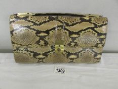 A vintage snakeskin hand bag.