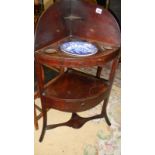 A mahogany corner washstand with blue and white basin.