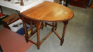 An oval Gateford table with barley twist legs