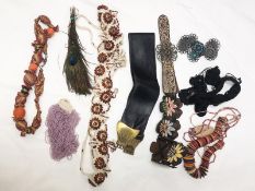 A selection of handcrafted belts & necklaces (beads, leather patches,