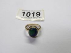 An Azurite-malachite cabochon ring in 9ct yellow gold, size N, total weight 4.64 grams.
