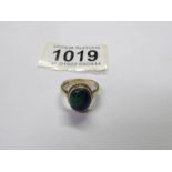 An Azurite-malachite cabochon ring in 9ct yellow gold, size N, total weight 4.64 grams.