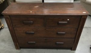 A medium oak 4 drawer chest of drawers