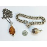 A silver & amber pendant on silver chain, silver pendant,