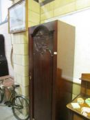 The end section of a Victorian mahogany triple wardrobe.