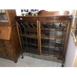 A bow front astragal glazed mahogany display cabinet.