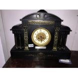A black slate clock with silver plaque dated 1901.
