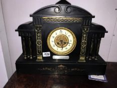 A black slate clock with silver plaque dated 1901.