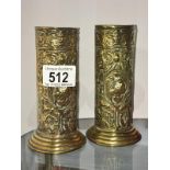 A pair of embossed brass vases A/F (one has split that needs soldering)