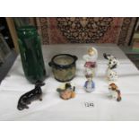 8 ceramic items including Beswick dachsund, Beswick Dalmation, Royal Doulton Highland Snowman,