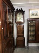 An oak 8 day long case clock marked J Stokes, Macclesfield.