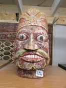 An Indian wooden Buddhistic head/temple guardian,