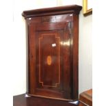 A marketry inlaid wall mounted corner cabinet