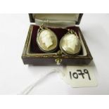 A pair of cameo earrings.