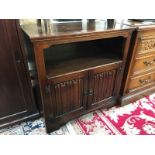 A side cabinet with folded linen carvings