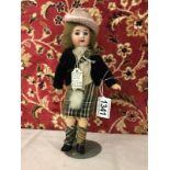 A bisque headed doll with composition body, jointed legs and arms, circa 1900,