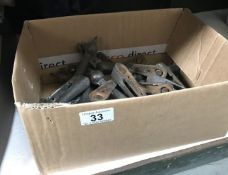 A box of vintage stair carpet rods