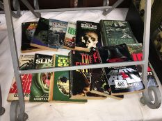 A collection of books including horror paperbacks