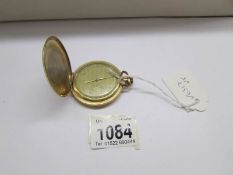 A full hunter pocket watch.