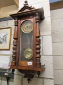 A mahogany Vienna wall clock.