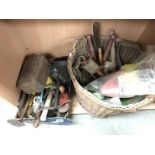 A quantity of old tools including wicker basket