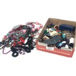 A box of costume jewellery including bead necklaces, brooches & bracelets etc.