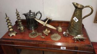 A collection of brass ornaments and a silver plated coffee pot