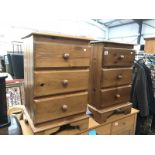 A pair of 3 drawer pine bedside chest of drawers