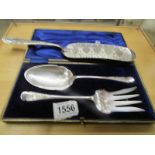 A cased pair of silver plate salad servers and a crumb scoop.