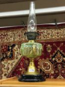 A Victorian oil lamp with vaseline glass font