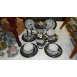 A dark grey dragon relief tea set (Crown & Laurel back stamp) with Geisha silhouette teacups