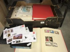 A box of stamp albums (some empty) and stamps on sheets etc.
