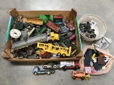 A box of die-cast toy trucks, lorries, cars & a box of toy signs, wheels etc.