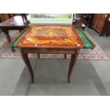 A marquetry inlaid games table with chess board, roulette etc.