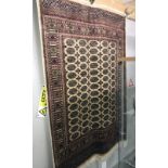 A beige ground Bokhara rug, 190 x 140 cm.