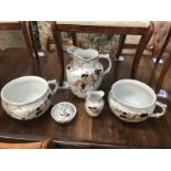 A pair of chamber pots, a jug and soap dish etc.