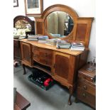 A 2 drawer, 2 door side cabinet with plate shelf, curved legs,