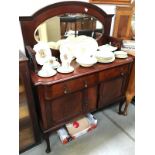 A 2 drawer 2 door dark wood side cabinet with curved legs,