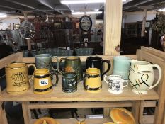 A quantity of tankards and mugs.