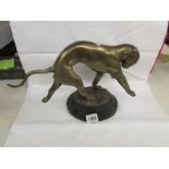 A brass figure of a large panther / puma