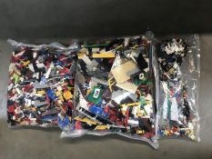 2 bags of lego and a smaller bag of lego figures