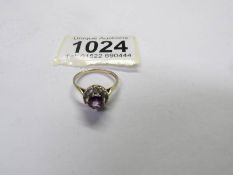 A round amethyst cluster ring in 9ct yellow gold, amethyst estimated carat weight 0.80.