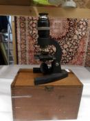 A wood cased Britex Minor microscope.