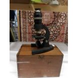 A wood cased Britex Minor microscope.
