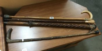 4 wooden walking canes