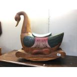 A partially painted carved wood waterfowl child's rocking chair (A/F been repaired)
